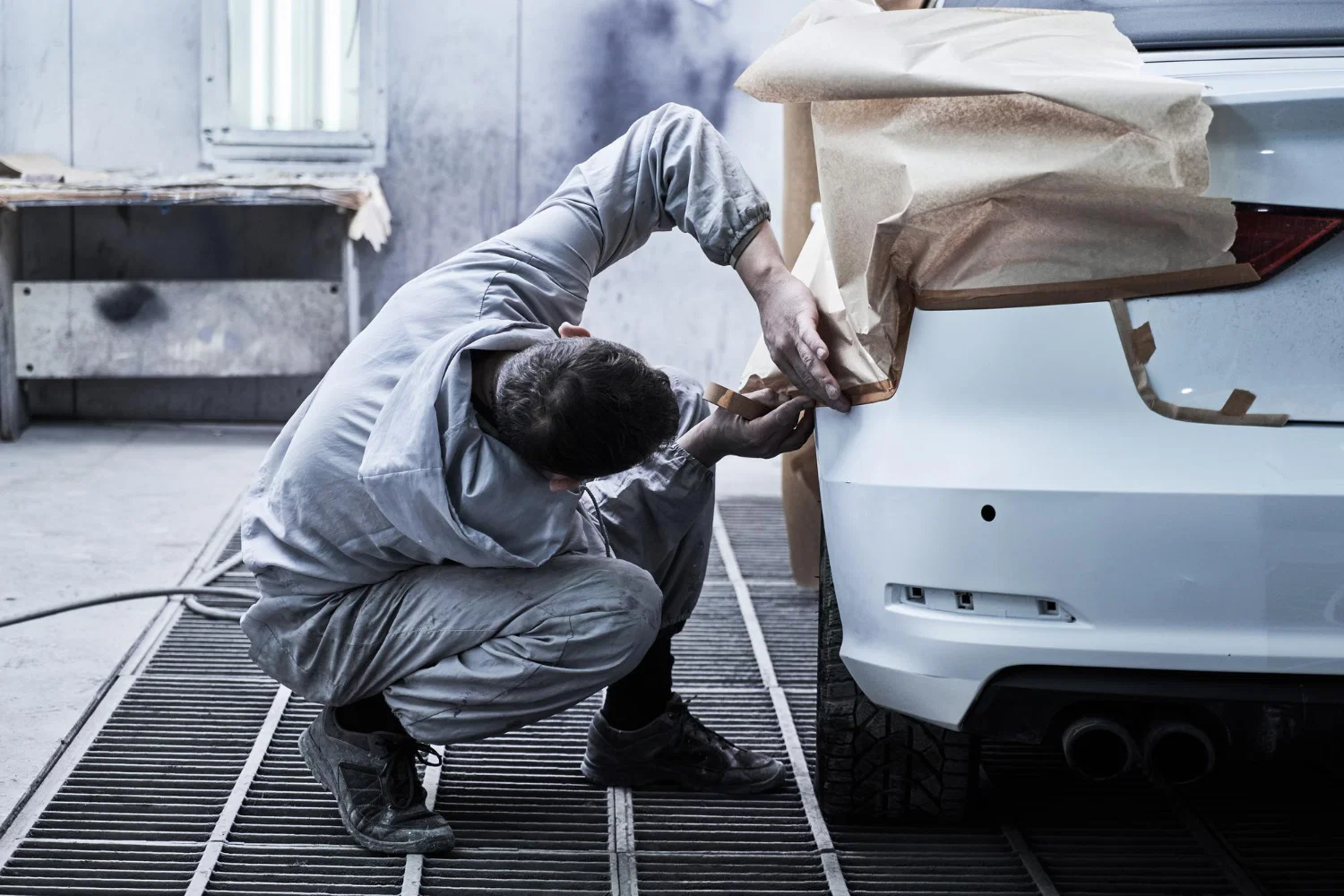 Professional auto paint repair and body damage restoration work at collision center