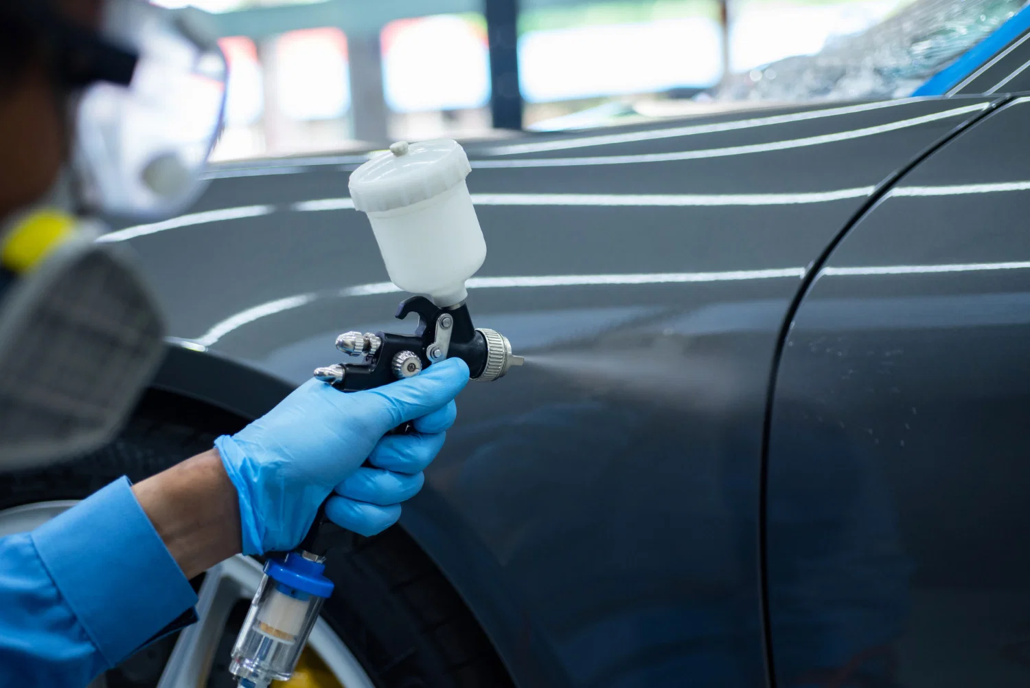 Professional panel beating repair work being performed at auto body shop